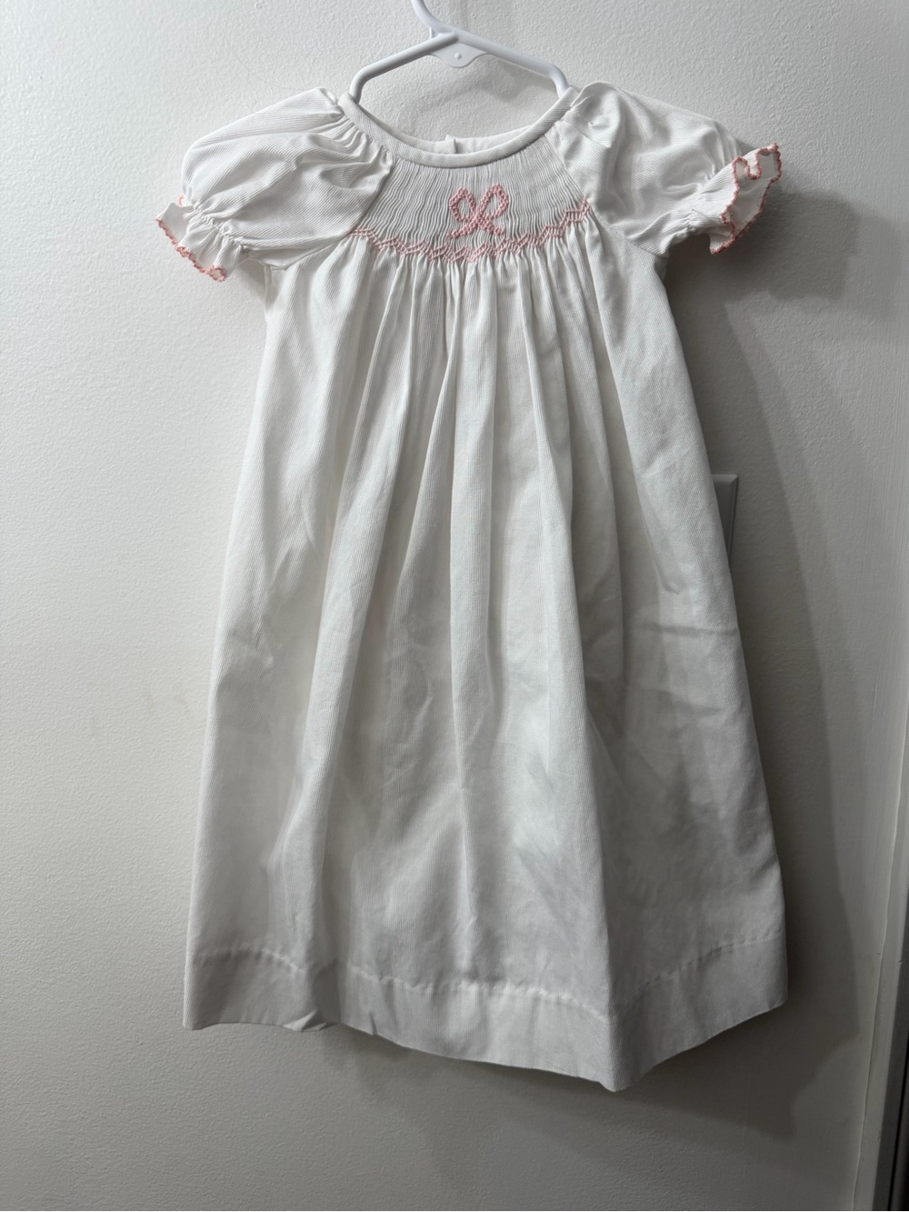 New! White Smocked Girls' Dress with Pink Trim and Bow
